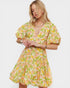 Woman wearing a floral dress on a white background