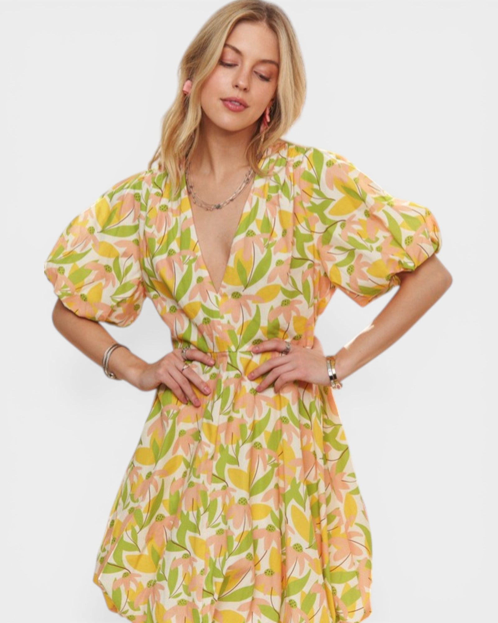 Woman wearing a floral dress on a white background