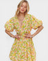 Woman wearing a floral dress on a white background