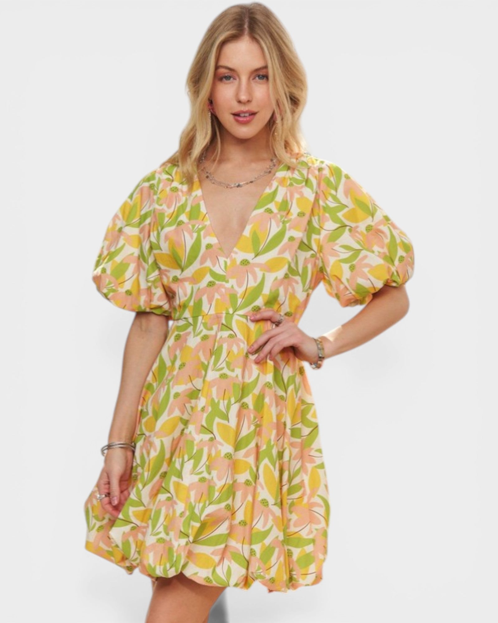 Woman wearing a floral dress on a white background