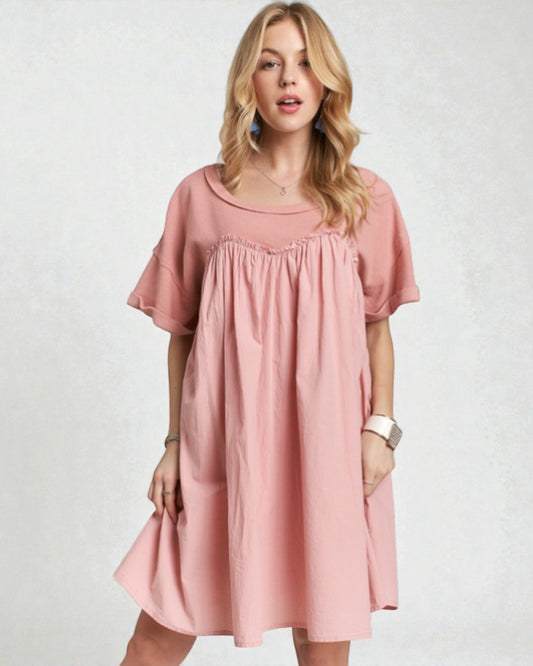 Woman wearing a pink dress on a white background