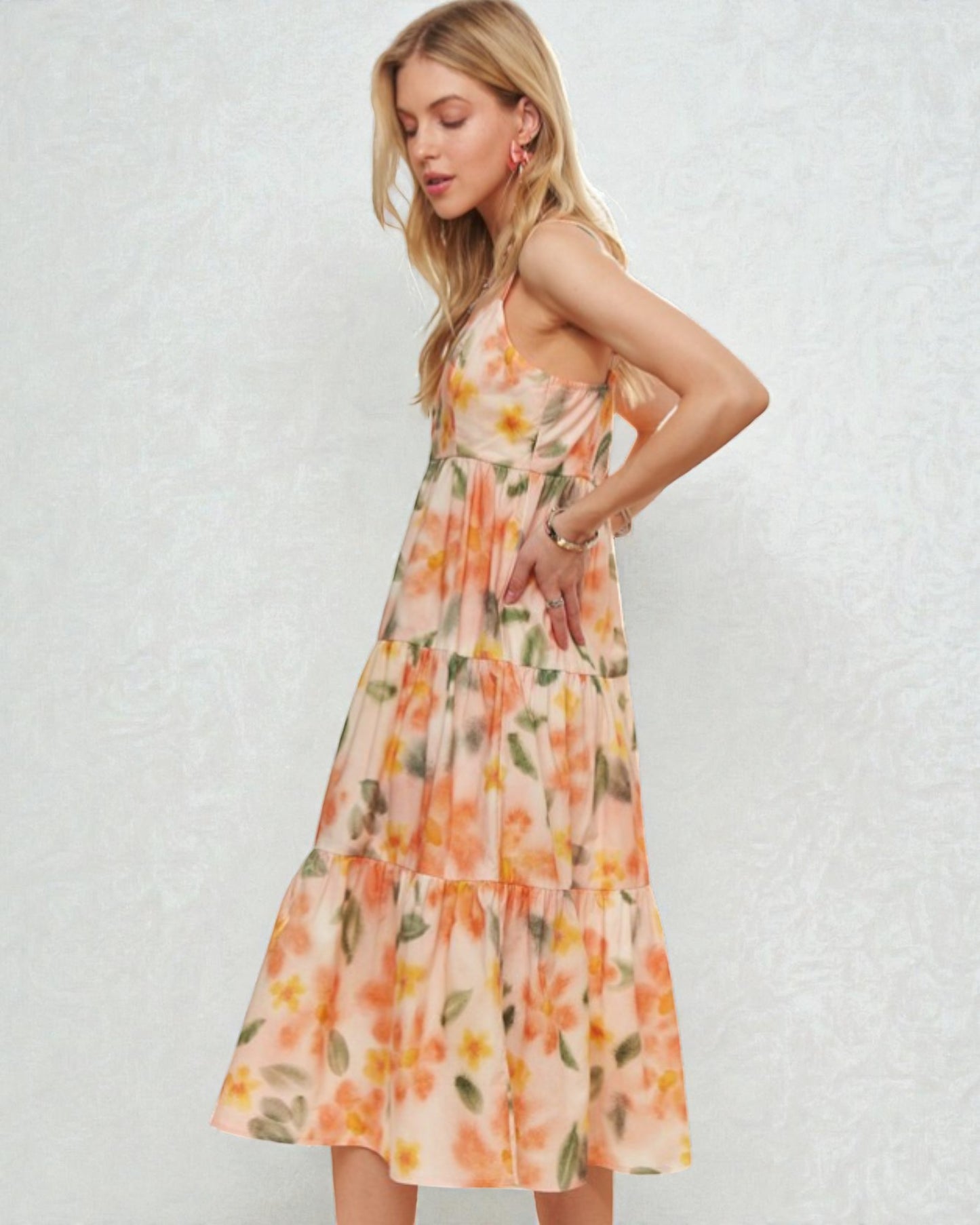 Woman wearing a floral dress against a plain background