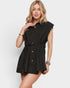 Woman wearing a black sleeveless dress on a white background