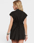 Woman wearing a black sleeveless dress on a white background