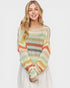 Woman wearing a colorful striped sweater on a white background
