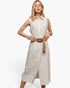 A woman modeling a sleeveless, button-front midi dress with thin vertical pinstripes in a light beige and white colorway, styled with a wide tan belt featuring a large round brown buckle, against a plain white studio background.