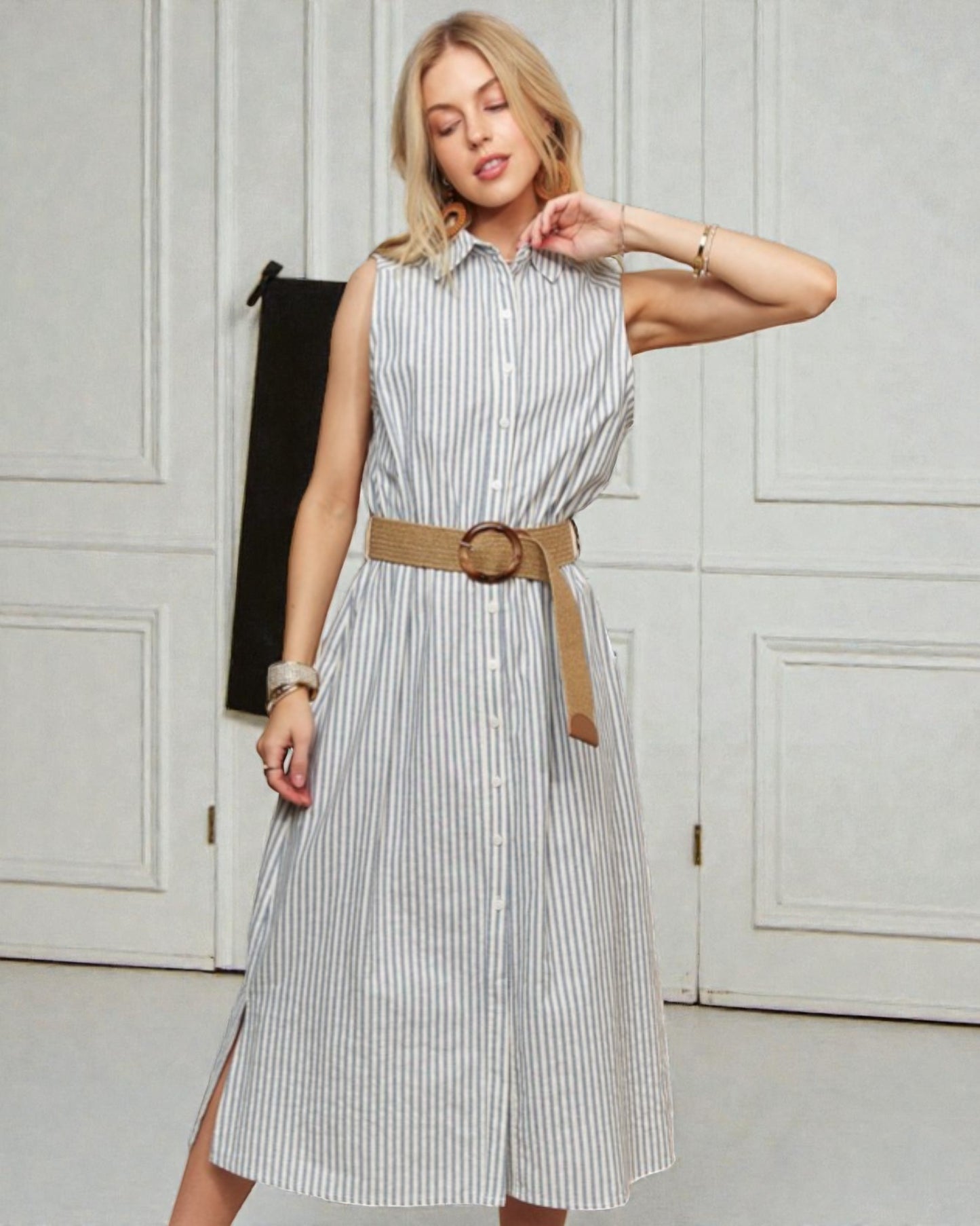 Woman wearing a striped dress with a belt in an indoor setting