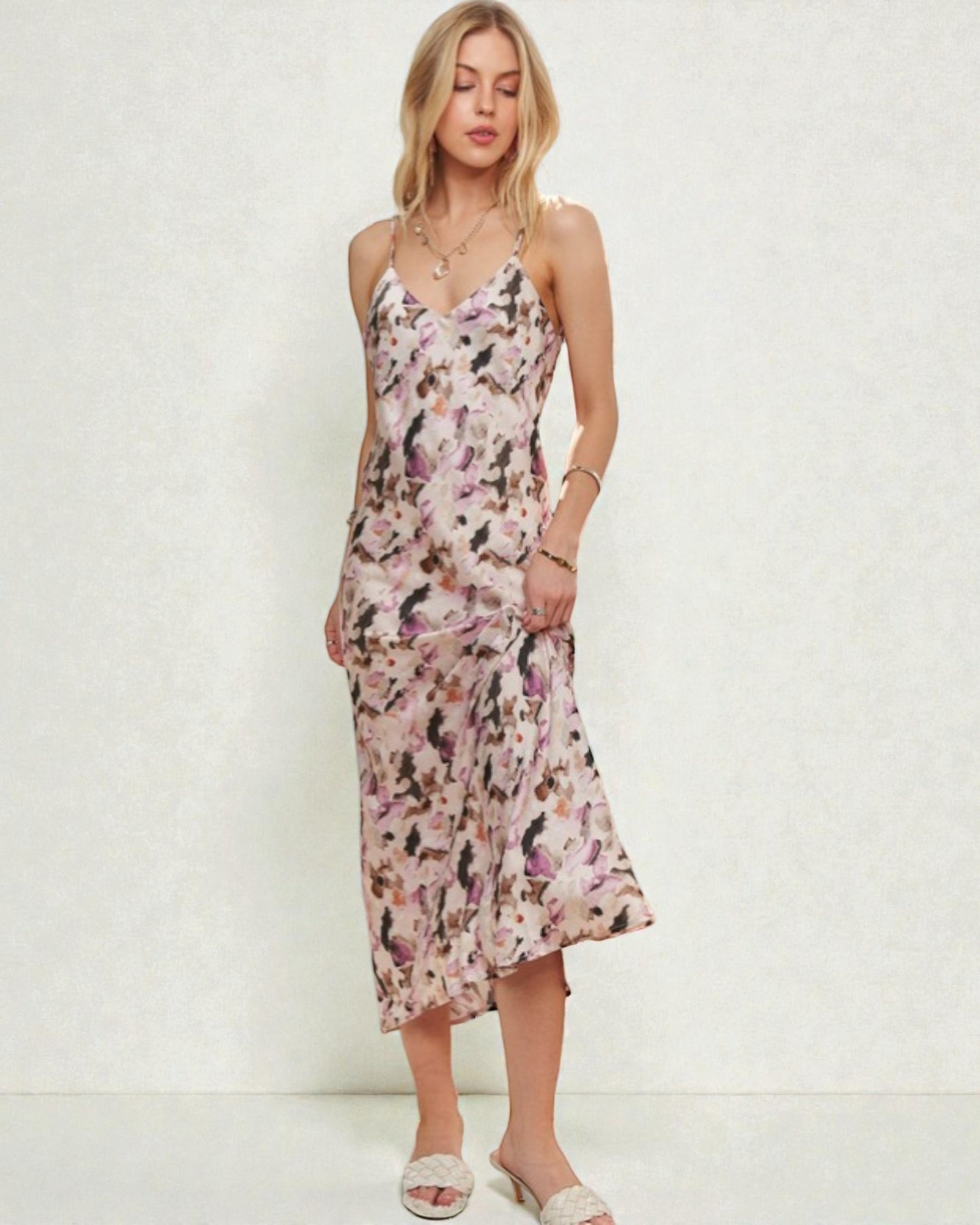 Woman wearing a floral dress against a white background