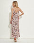 Woman wearing a floral dress against a white background