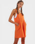 Woman wearing an orange dress on a white background