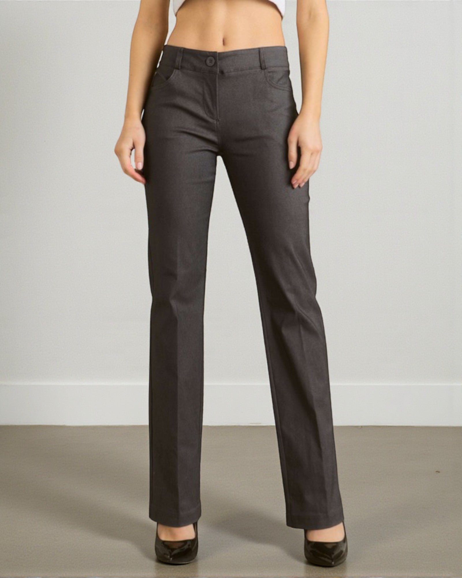 Dark gray pants worn by a person on a plain background