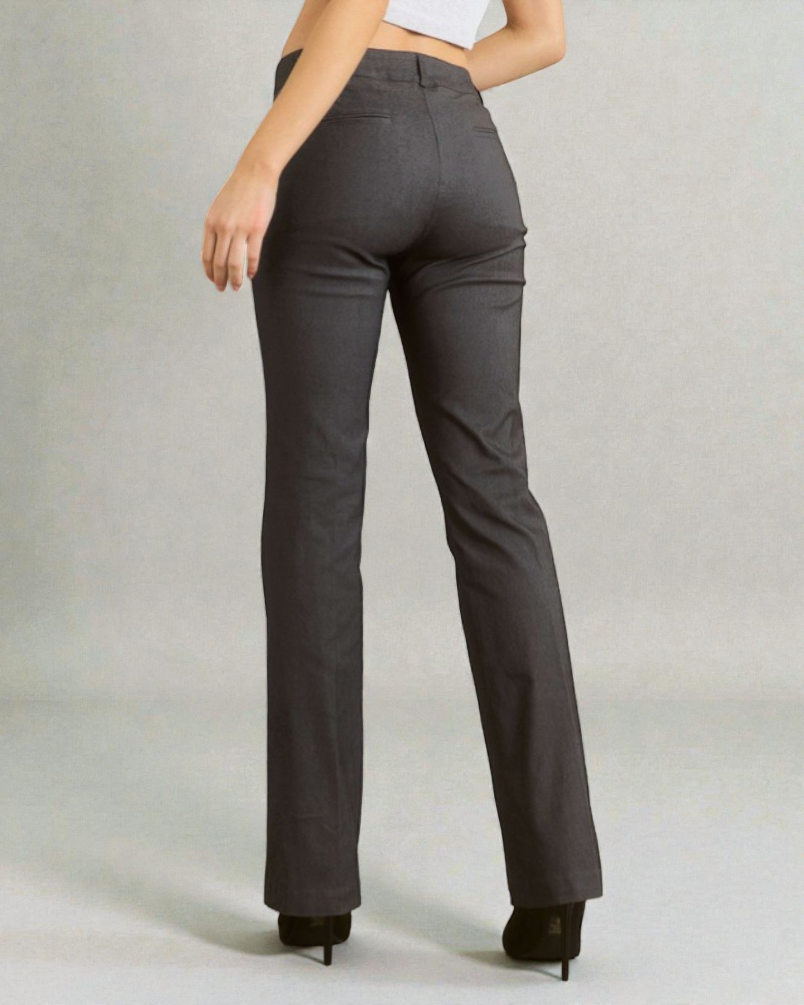 Person wearing gray pants on a plain background