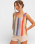 Woman wearing a colorful striped tank top against a plain background