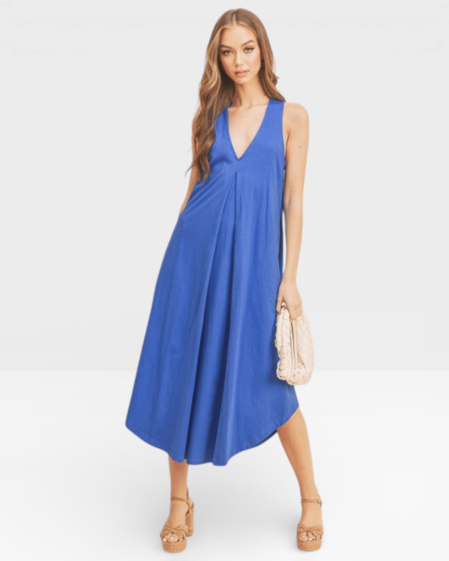 Woman wearing a blue dress on a white background