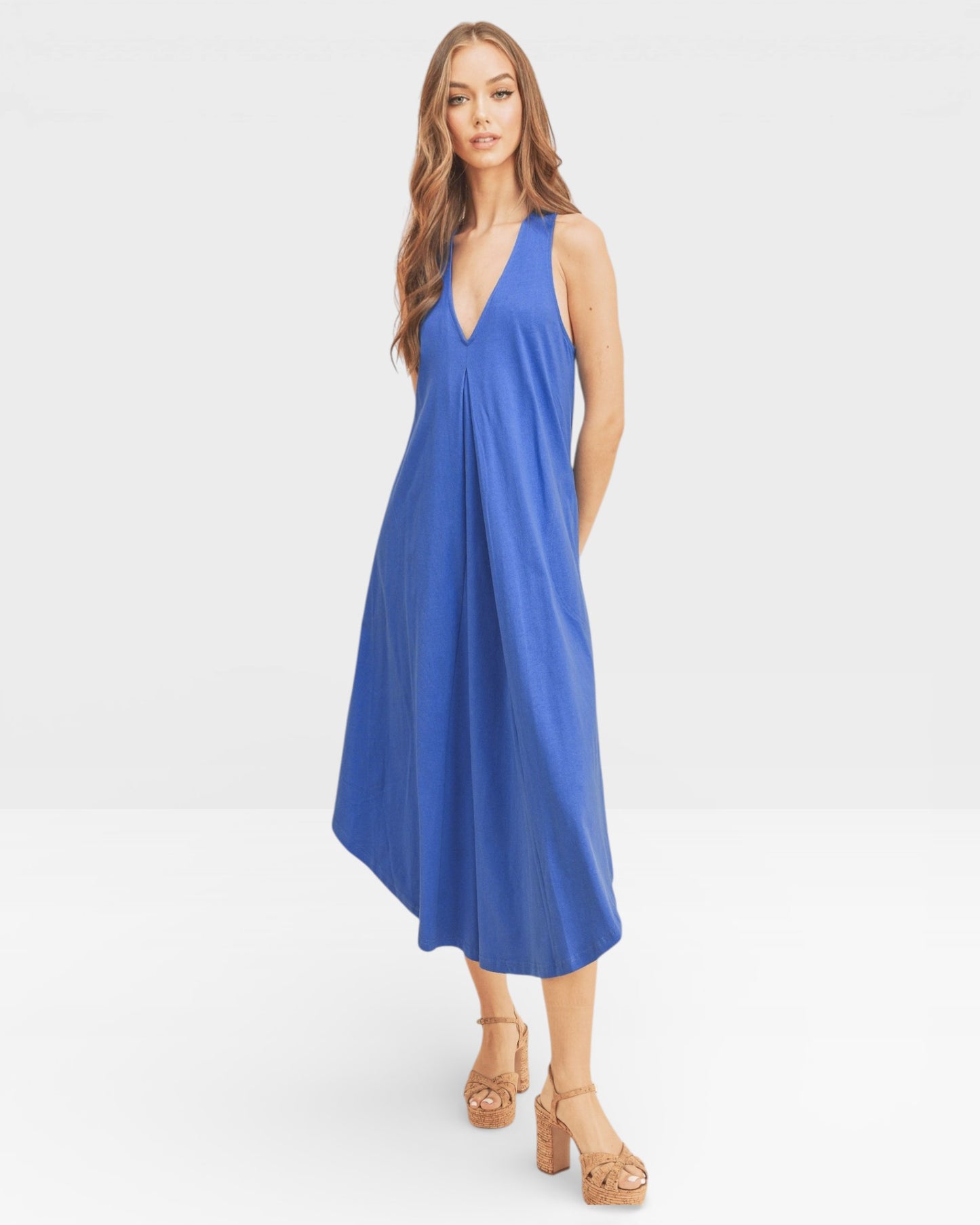 Woman wearing a blue dress on a white background