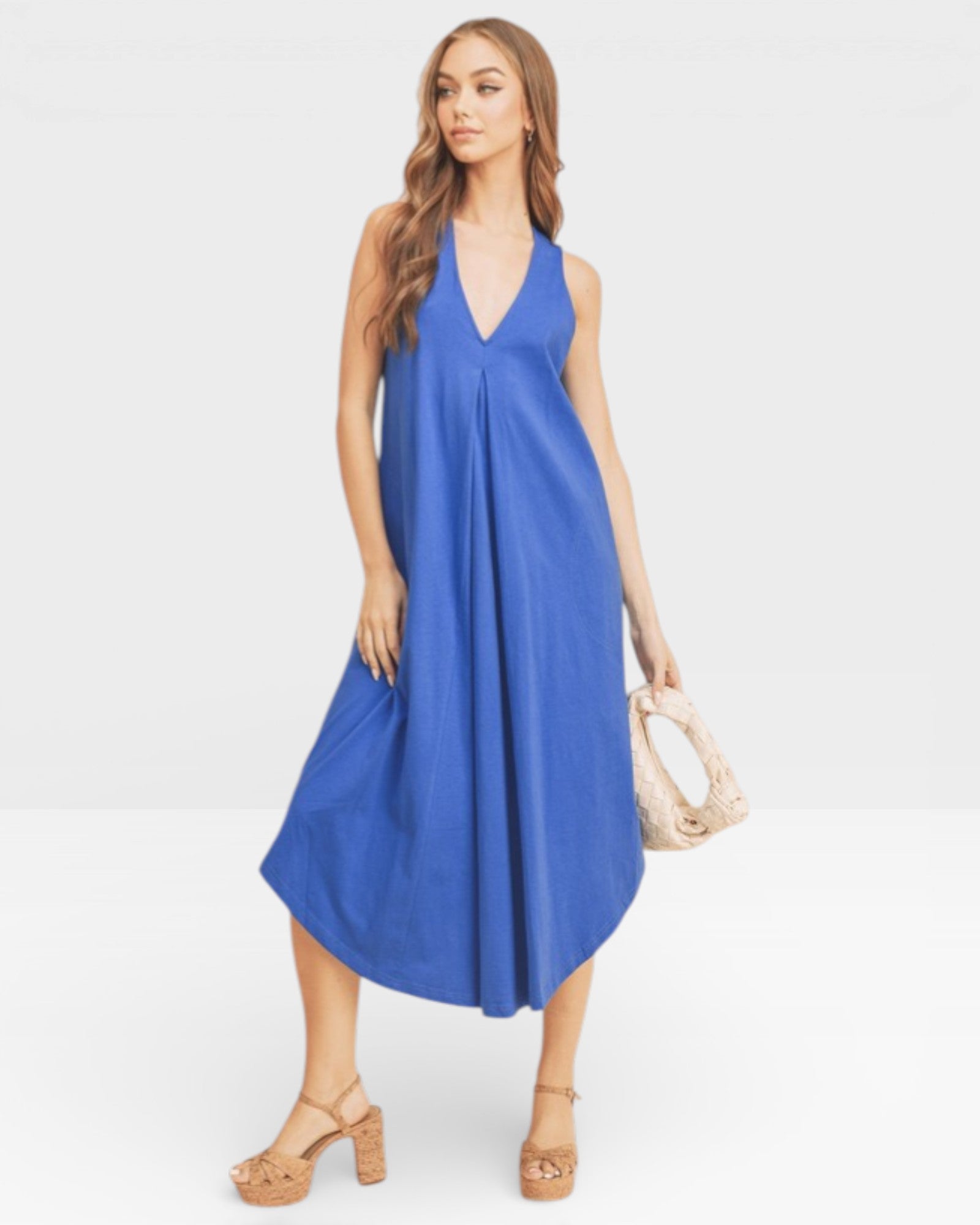 Woman wearing a blue dress on a white background