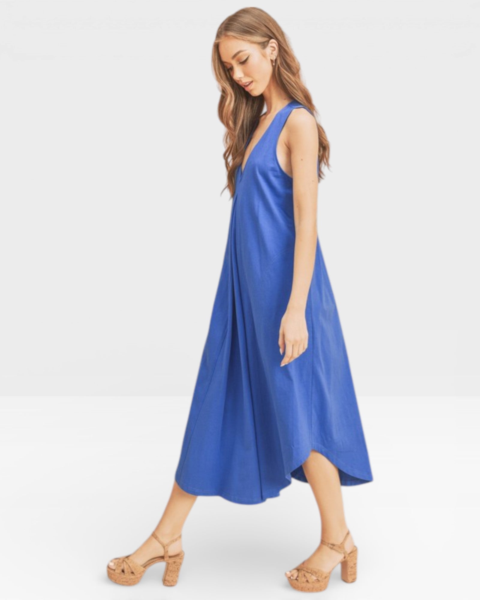 Woman wearing a blue dress on a white background