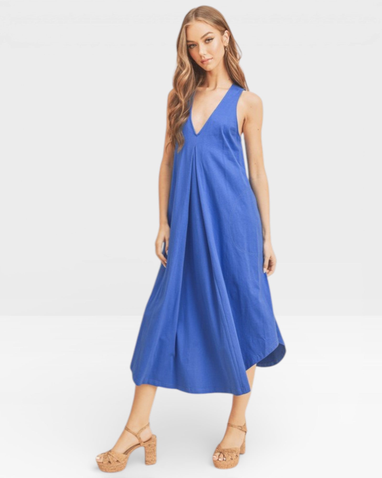 Woman wearing a blue dress on a white background