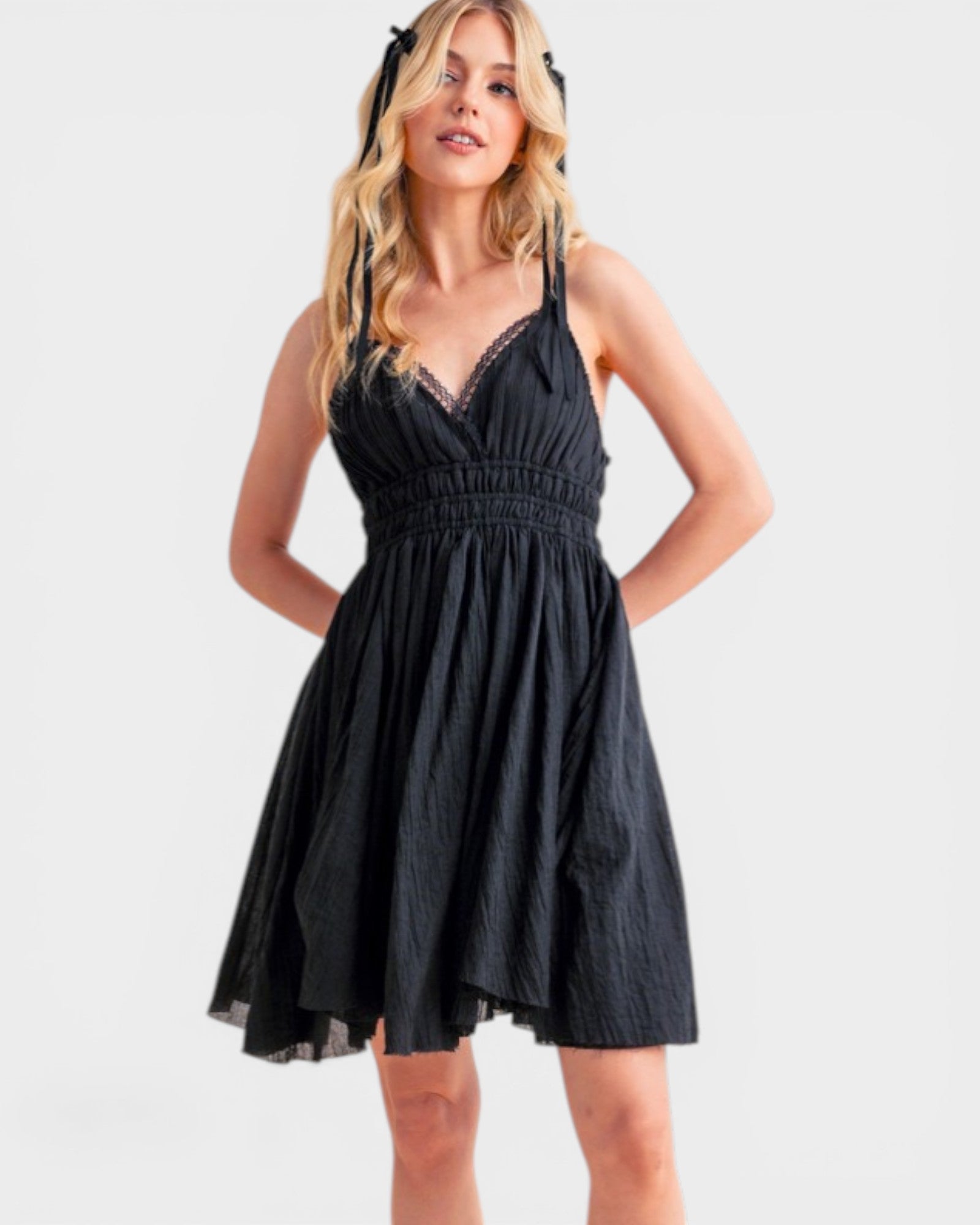 Woman wearing a black dress on a white background