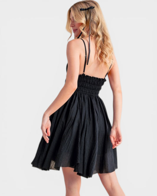 Woman wearing a black dress on a white background