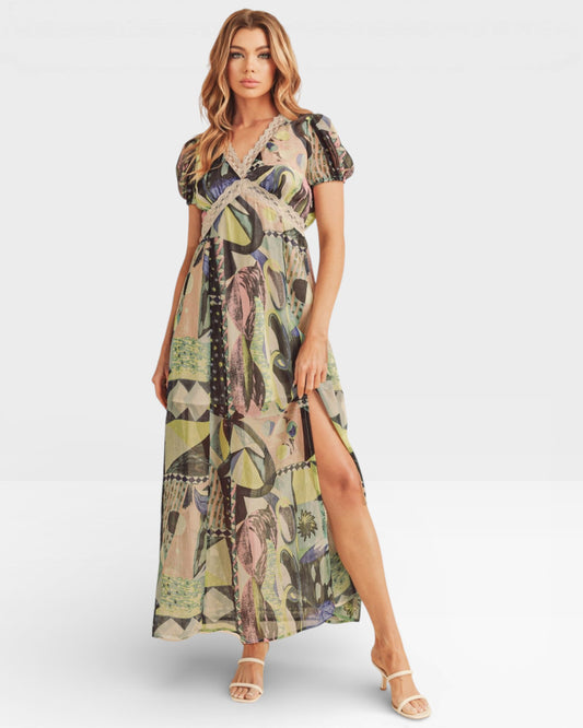 Woman wearing a patterned dress on a white background