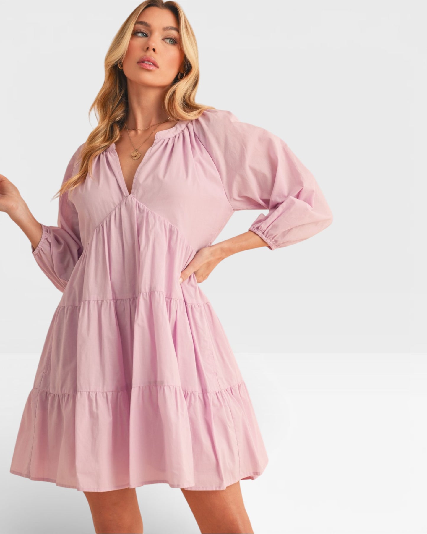 Woman wearing a pink dress on a white background