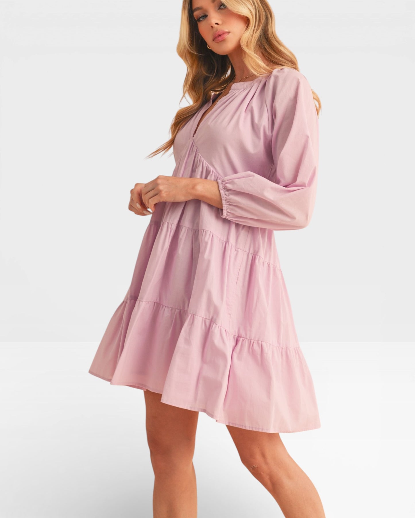 Woman wearing a pink dress on a white background