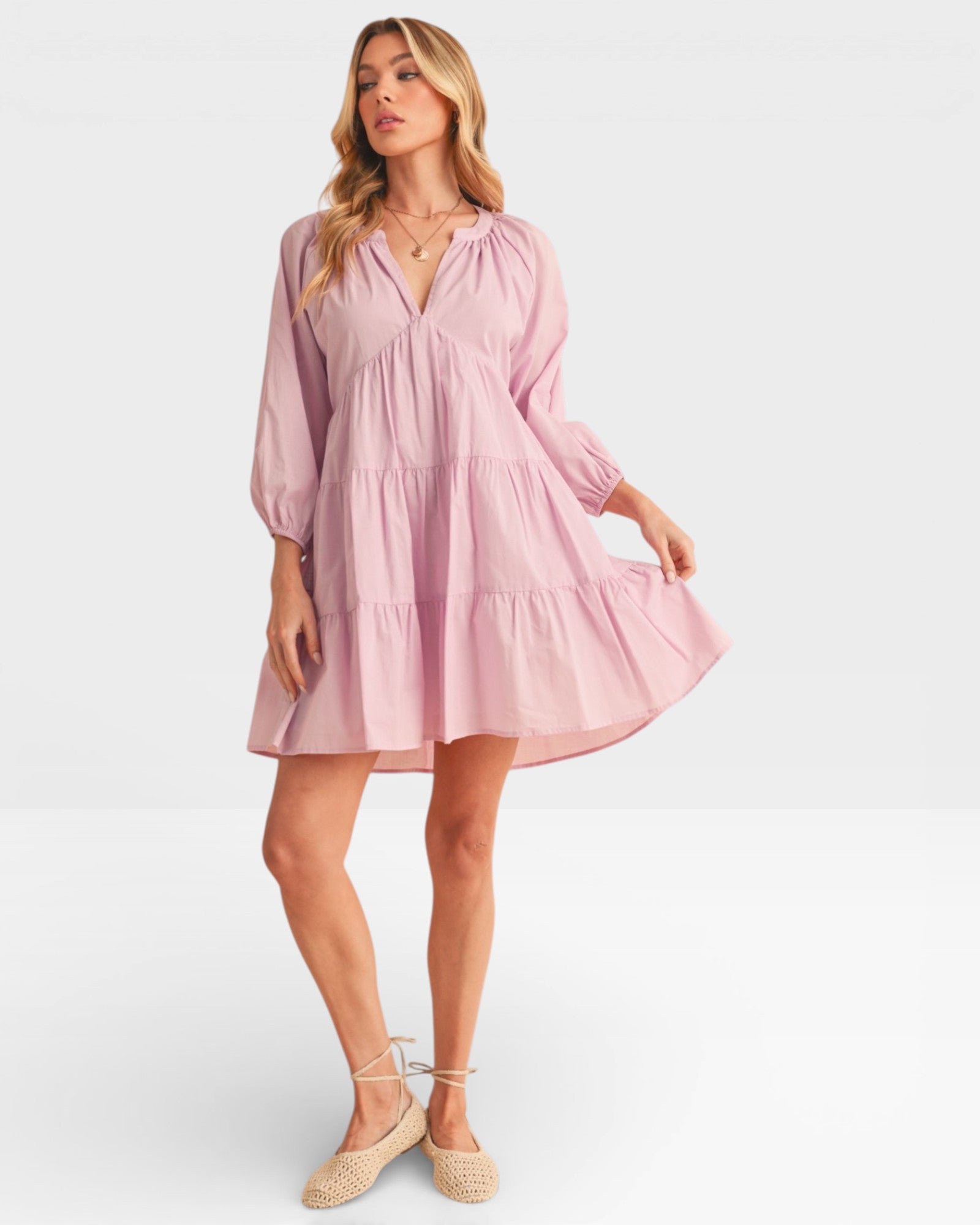 Woman wearing a pink dress on a white background