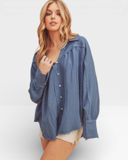 Woman wearing a blue denim shirt on a white background