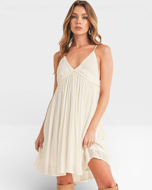 Woman wearing a white dress on a white background