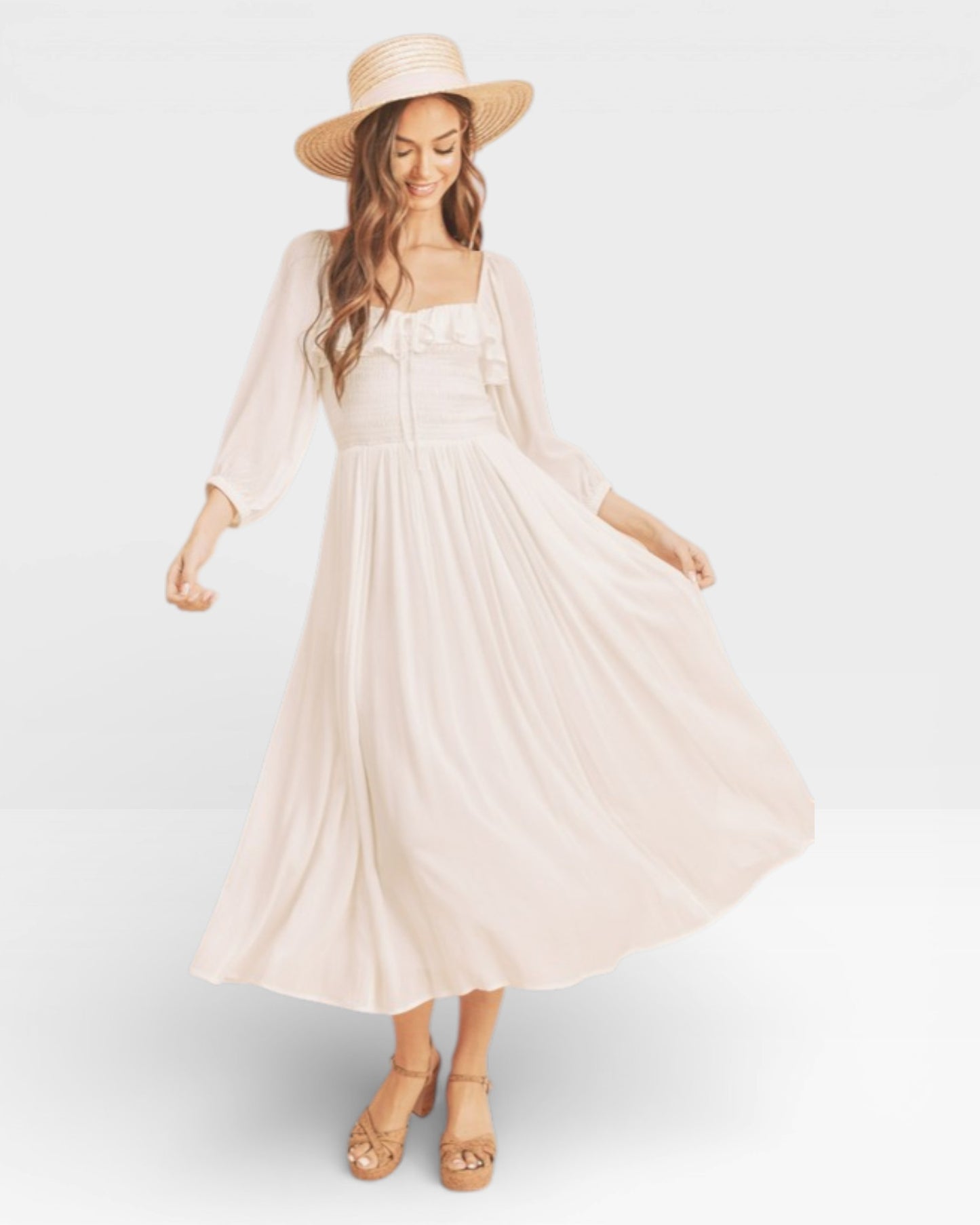 Woman wearing a white dress and straw hat on a plain background