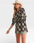 Woman wearing a plaid shirt and cowboy hat on a white background