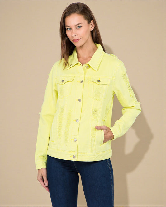 Woman wearing a bright yellow jacket against a beige background