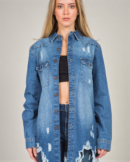 Woman wearing a blue denim jacket on a plain background