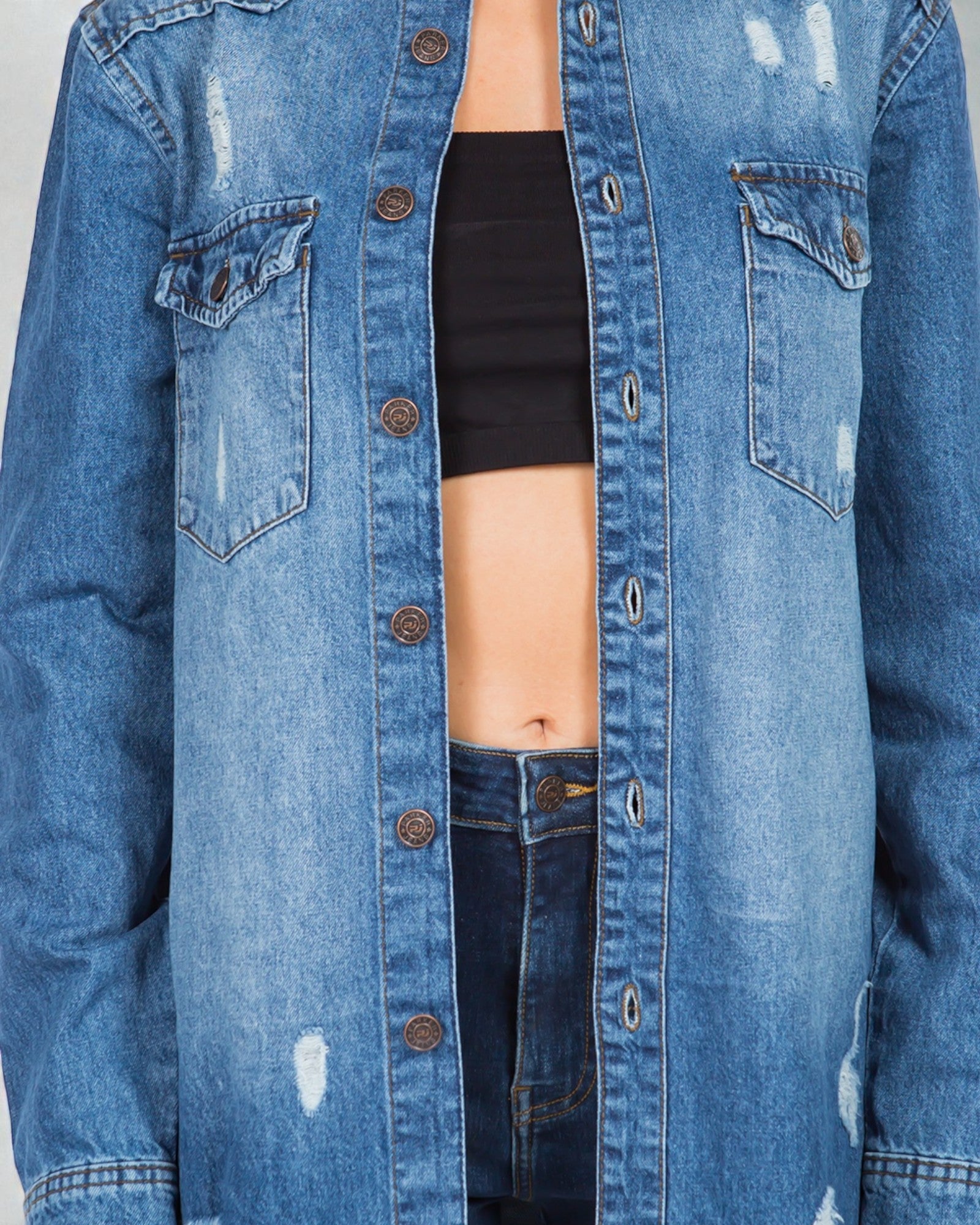 Blue denim jacket with a plain background