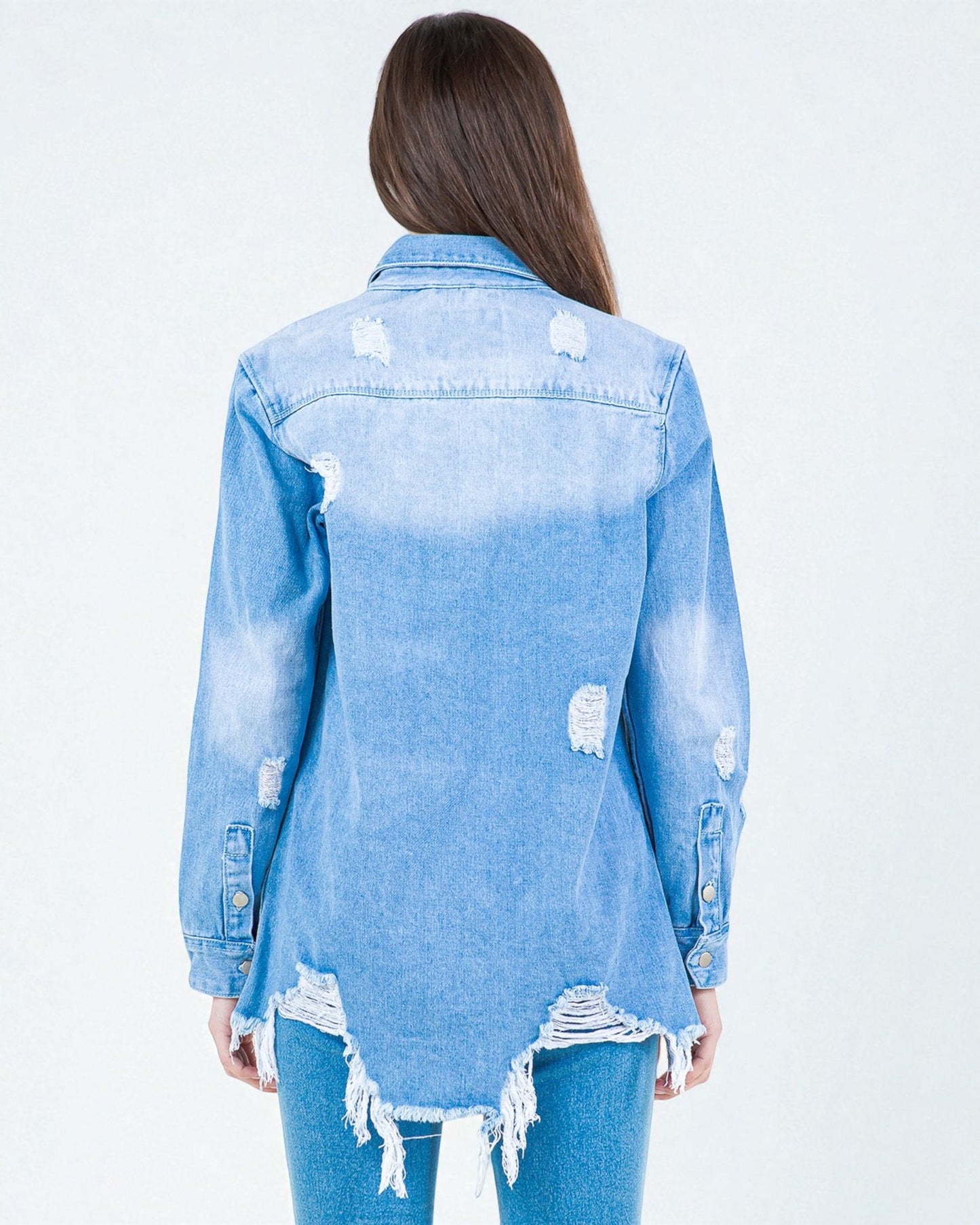 Light blue distressed denim jacket worn by a person on a white background