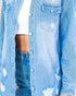 Light blue denim jacket with distressed details over a white shirt.