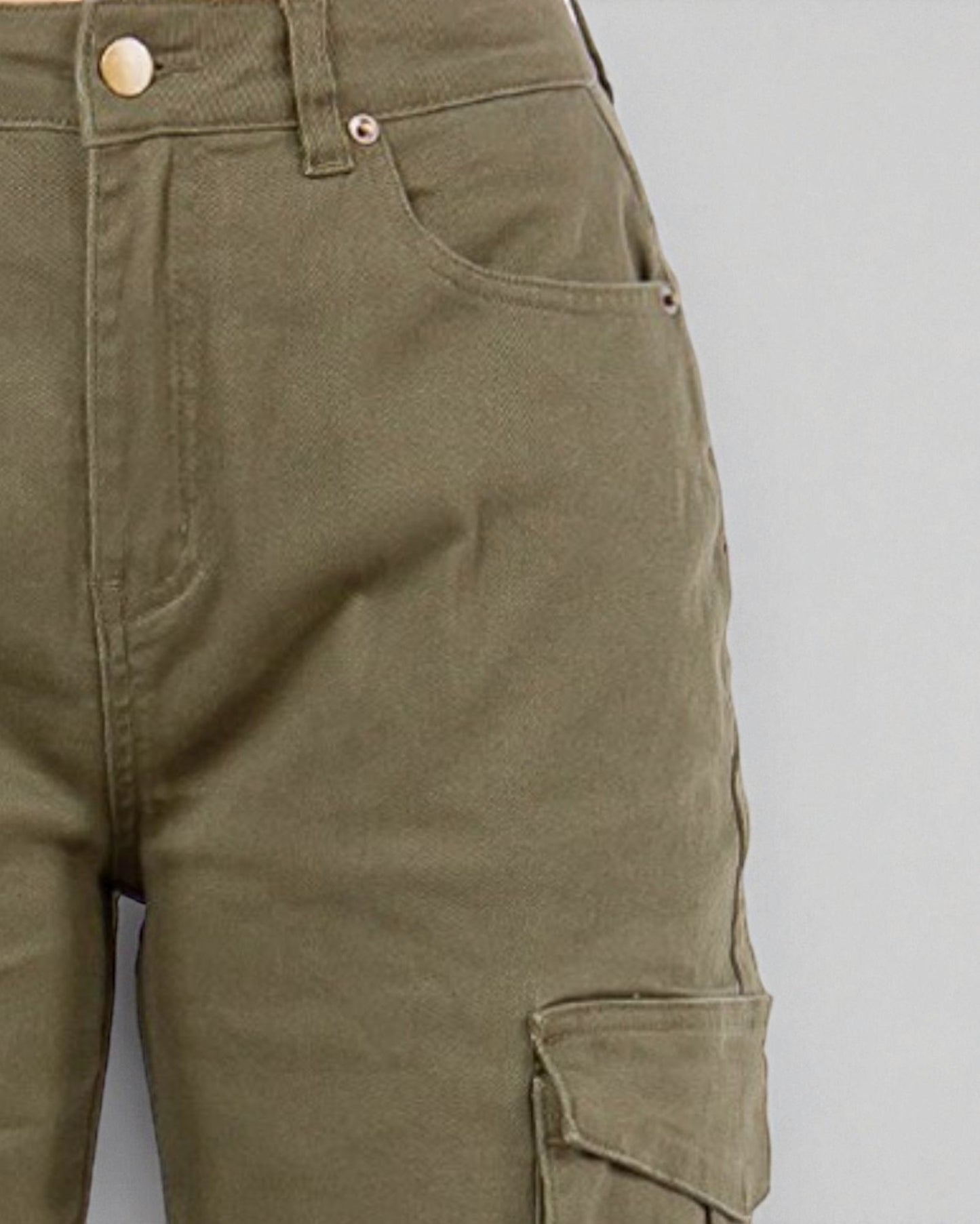 Close-up of green cargo pants on a gray background
