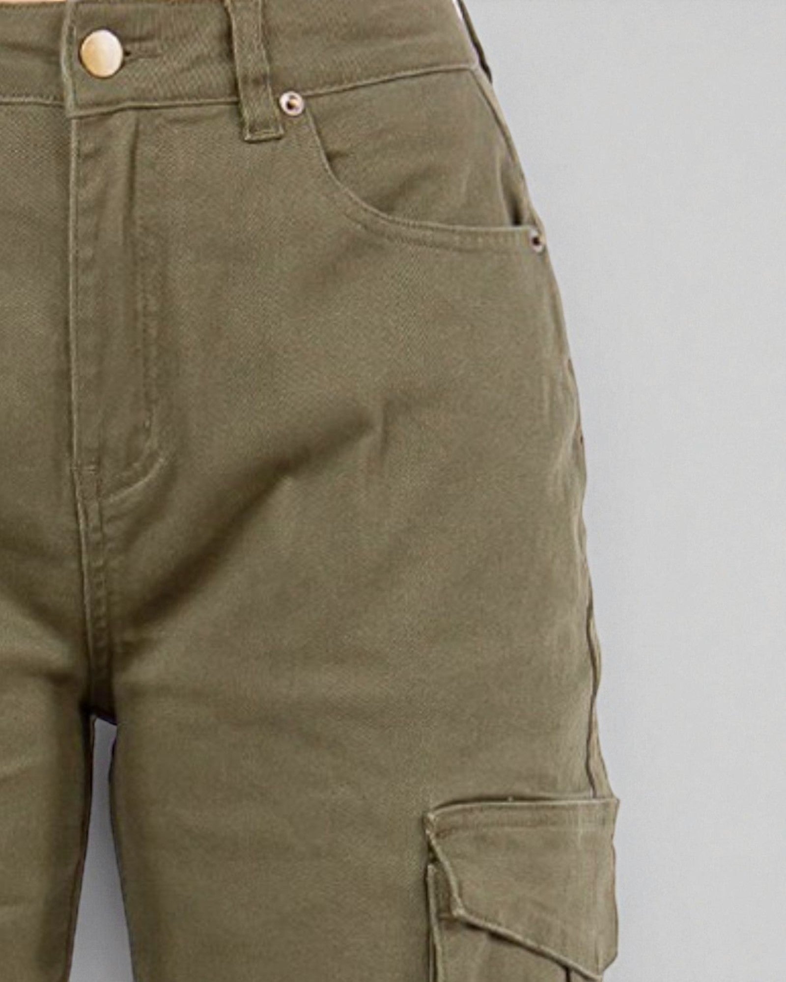 Close-up of green cargo pants on a gray background