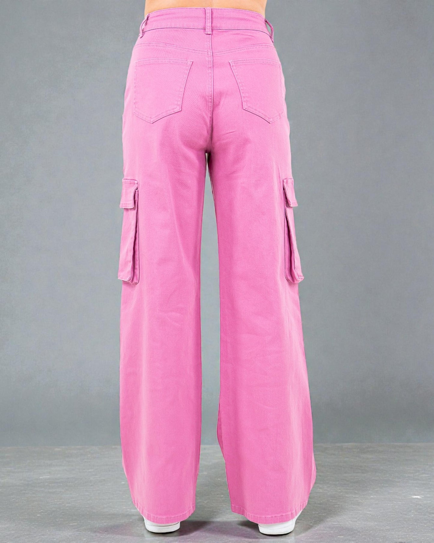 Pink cargo pants on a gray background