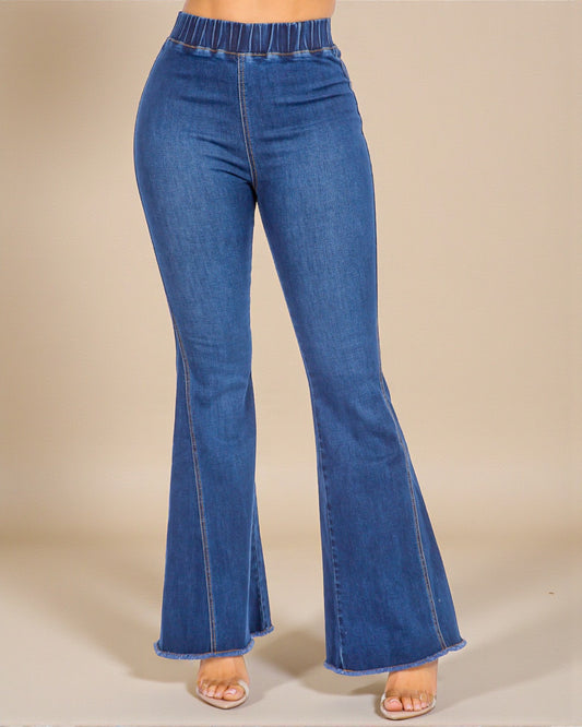 Blue flared jeans on a beige background