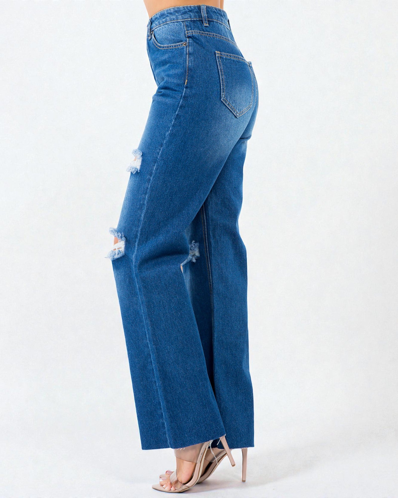 Blue jeans with a slight distressed look on a white background