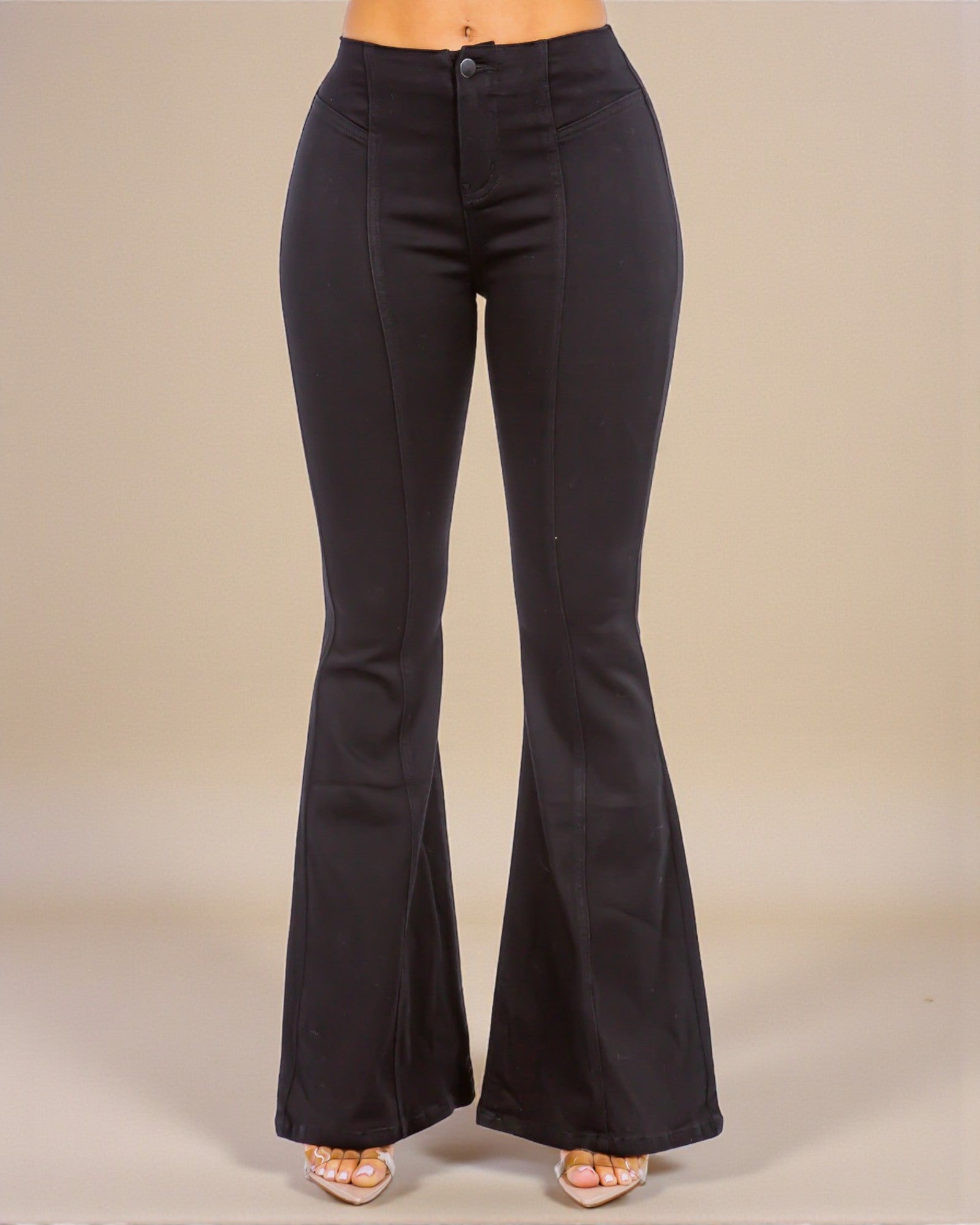 Black flared pants on a neutral background