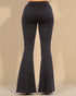 Black bell-bottom pants on a beige background