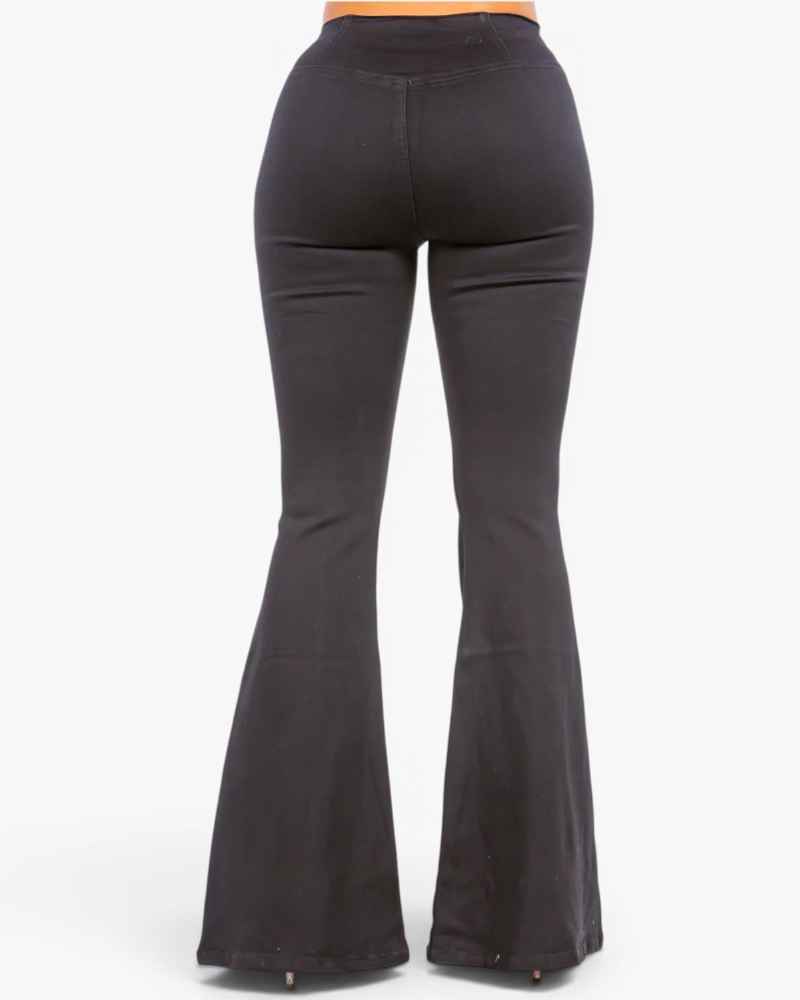 Black flared pants shown from the back on a model, featuring a high-waisted fit that transitions into a wide bell-bottom leg, photographed against a plain white background.