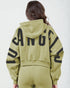 Person wearing a green hoodie with 'ANGELO' printed on the back against a white background