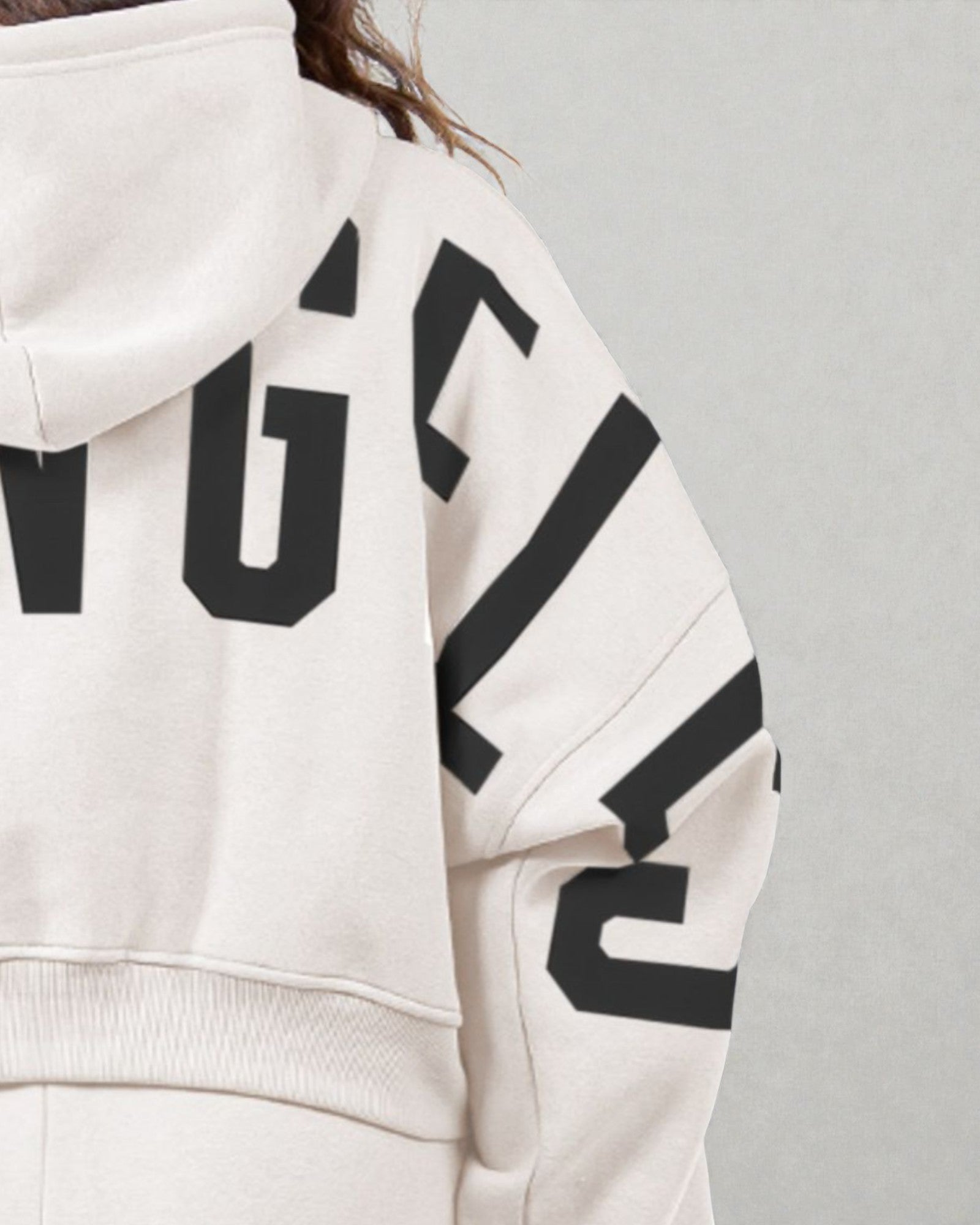 White hoodie with black text on a gray background