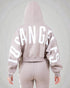 Light pink hoodie with 'Los Angeles' text on the back against a gray background