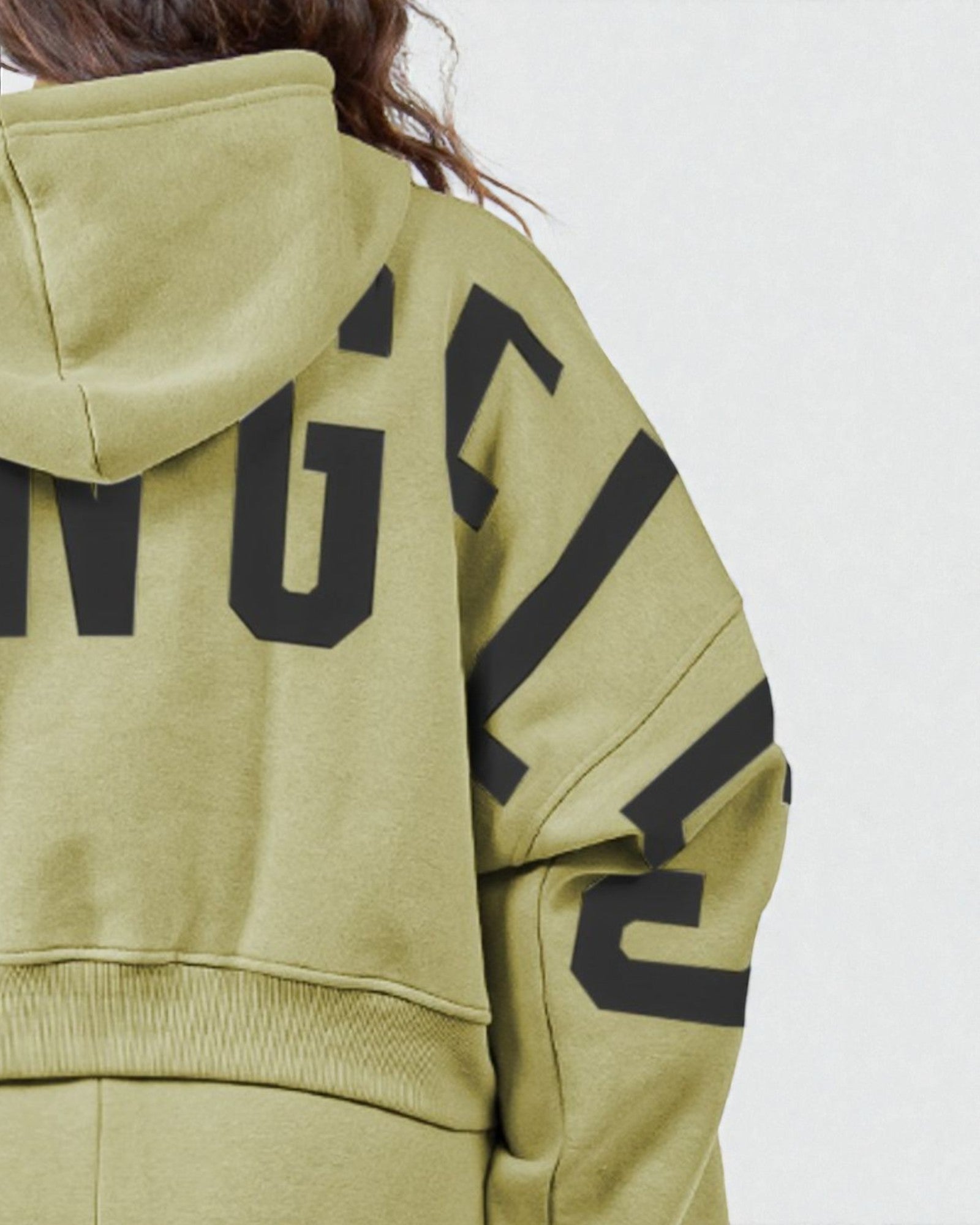 Green hoodie with black text on a plain background