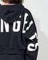 Black hoodie with white text on a plain background